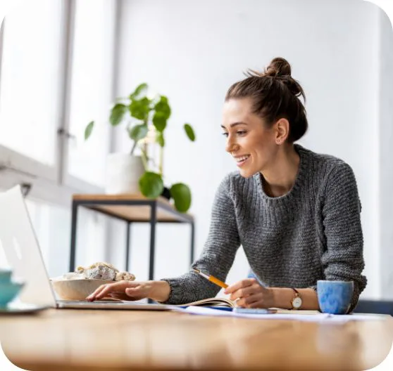 woman entering data on laptop