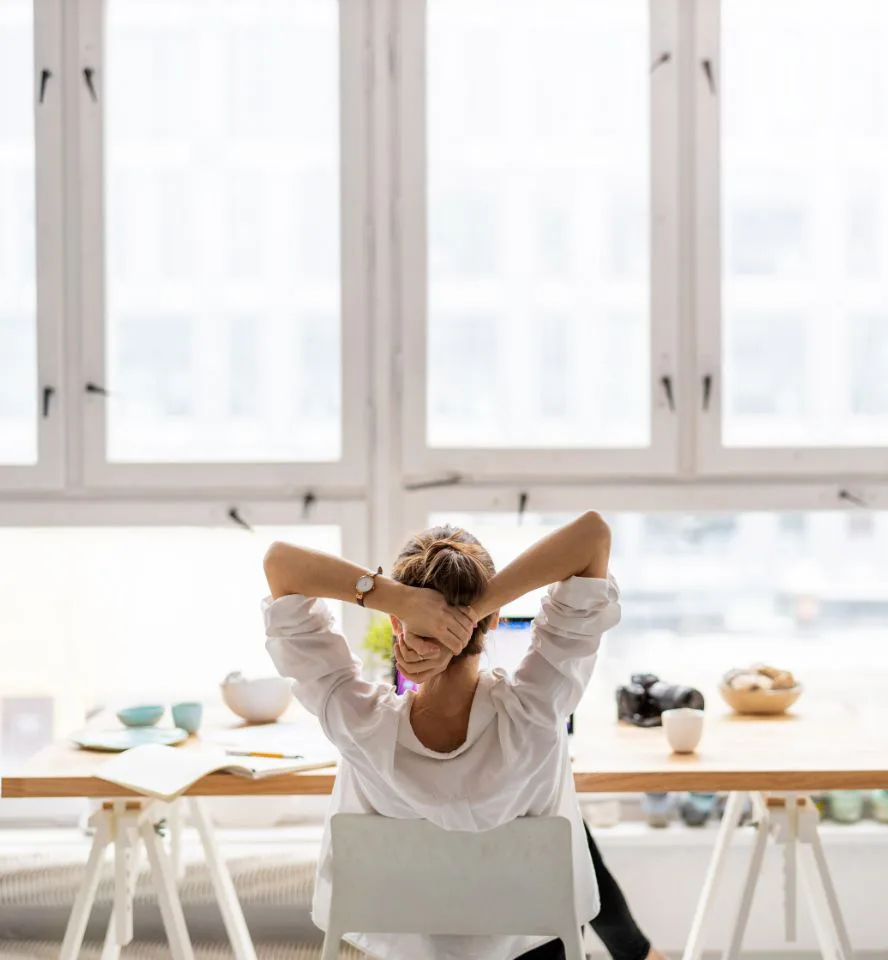 woman sitting peacefully at desk